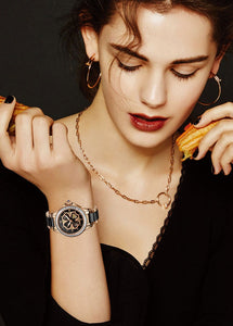 Woman wearing 4 leaf clover watch at zaddyzems.com